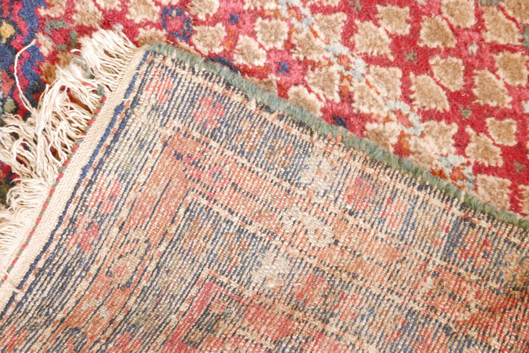 An antique, deep pile, hand woven wool Persian rug. With geometric designs in a central panel & blue - Image 4 of 5