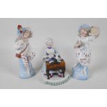A C19th continental porcelain figurine, of a seated lady playing the spinnet, 5½" high. Together