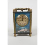 A miniature brass carriage clock with pictorial enamel panels, 3" high