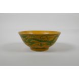 A Chinese yellow & green glazed porcelain bowl, with incised dragon decoration, Ming 6 character
