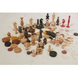 A quantity of C19th chess & chequers pieces, mother of pearl counters, etc