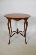 A 19th C mahogany oval occasional table with satinwood banded top and shaped supports, inlaid with