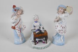 A C19th continental porcelain figurine, of a seated lady playing the spinnet, 5½" high. Together