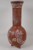 A Mexican terracotta vessel with long neck and flared rim and sgraffito decoration of flying ducks