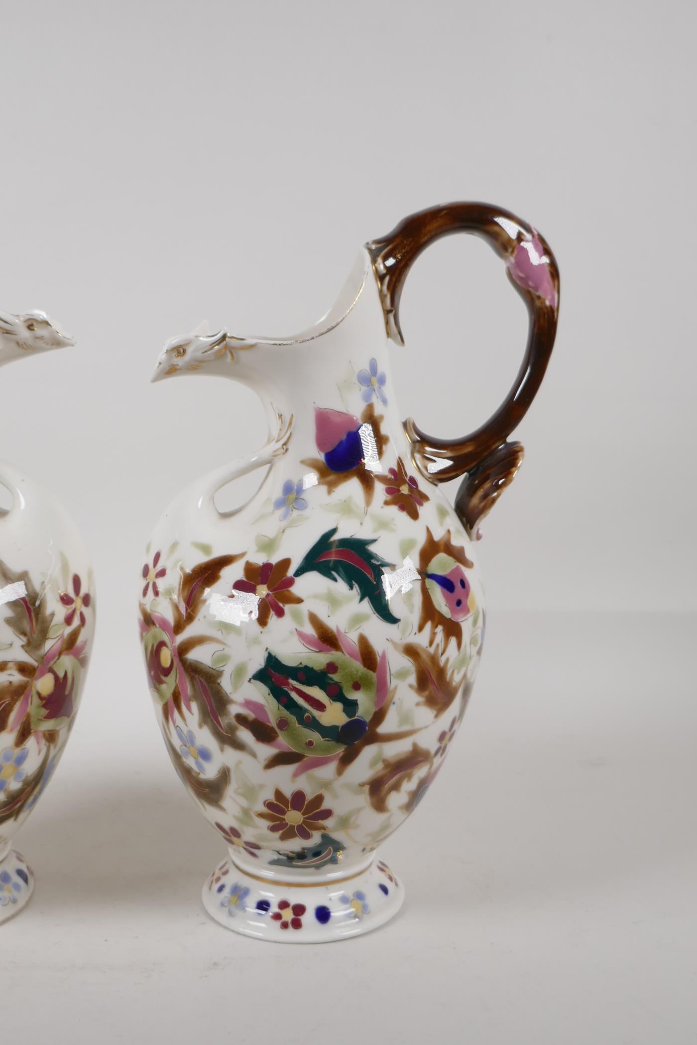 A pair of continental Zsolnay style ewers, decorated with an Iznik design. 11" high - Image 3 of 6