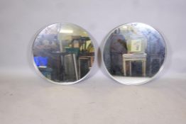 A pair of metal frame wall mirrors, 28" diameter