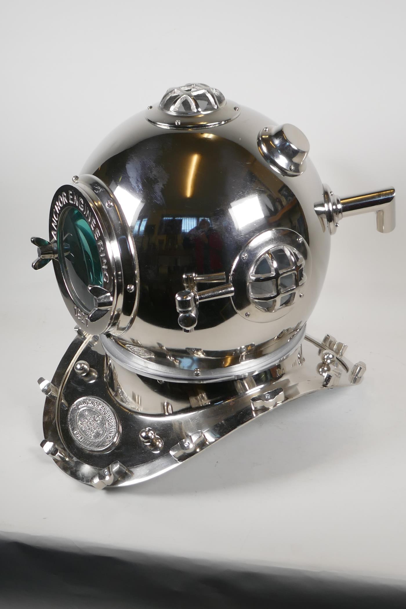 A chrome plated replica divers helmet, 17" high