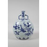 A Ming style blue and white porcelain moon flask, decorated with birds perched on branches in bloom,