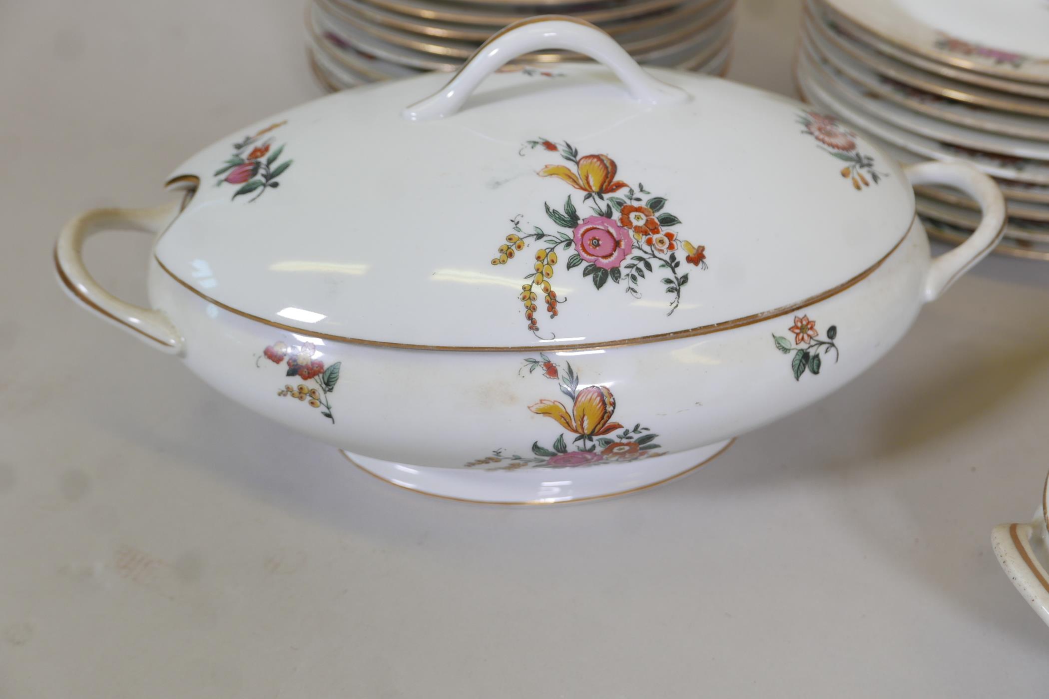 A Limoges floral decorated part dinner service comprising 10" and 12" oval tureens and covers, two - Image 2 of 6