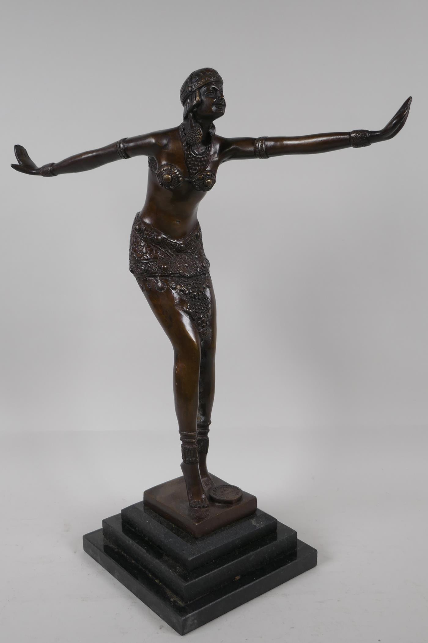 An Art Deco style figurine of a dancing girl, after Preis, on a stepped base, 16½" high