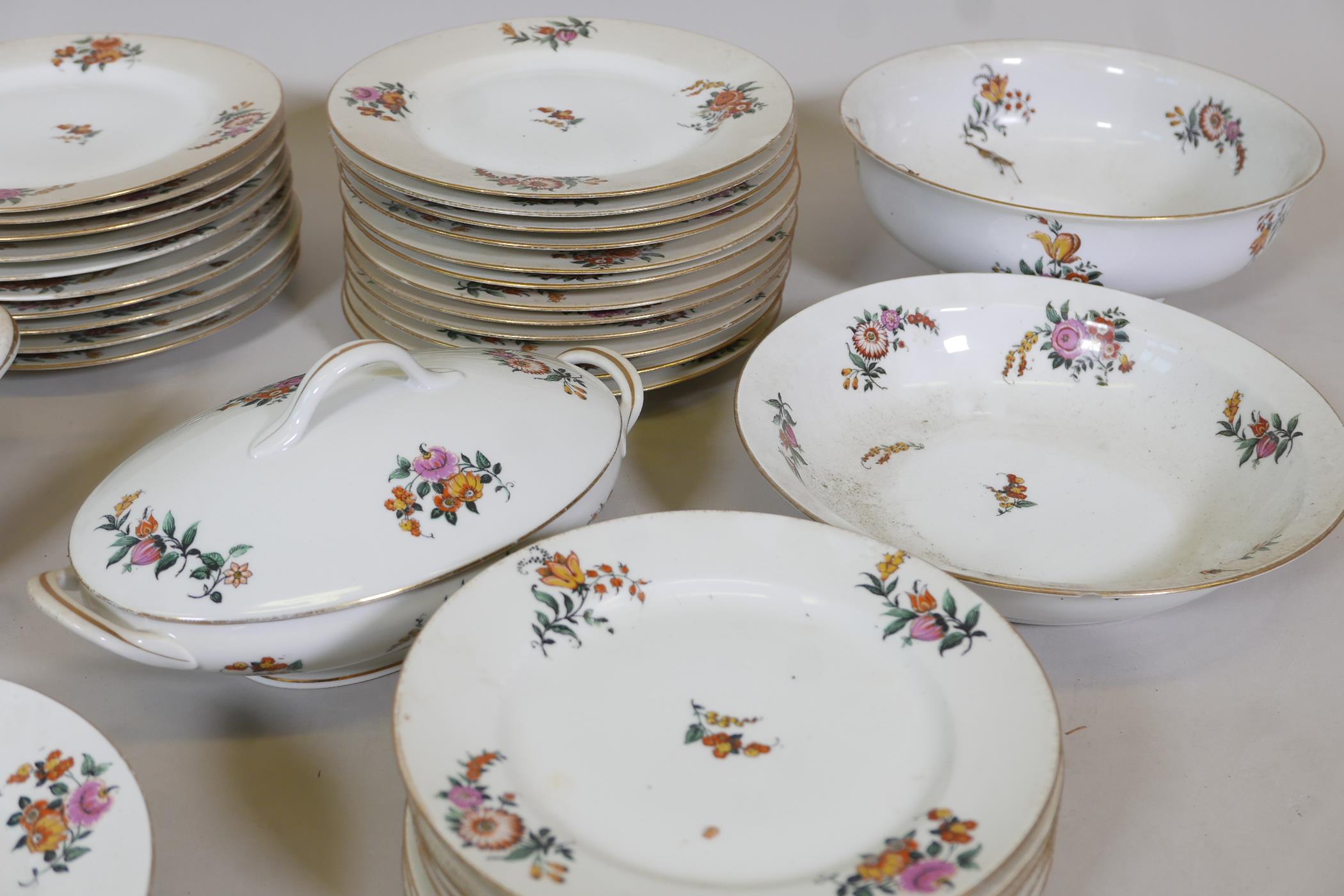 A Limoges floral decorated part dinner service comprising 10" and 12" oval tureens and covers, two - Image 4 of 6