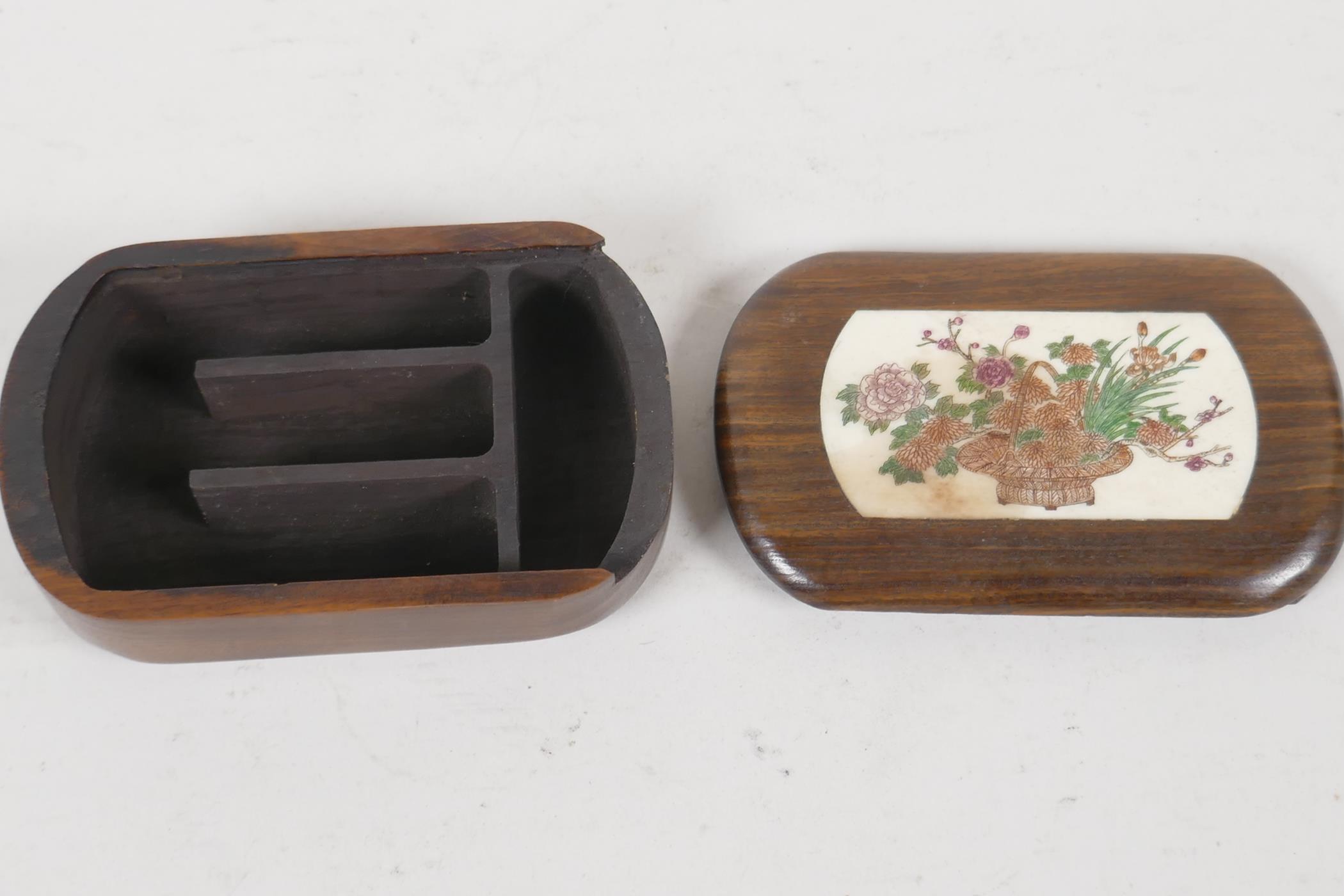 A Japanese hardwood trinket box. With a sliding lid, inset with bone panel, engraved and painted - Image 2 of 2