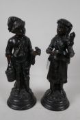 A pair of French terracotta figurines of a peasant man and woman, 13" high