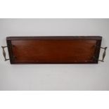 A C19th carved mahogany tray, with brass handles, 22¾" x 7½" wide