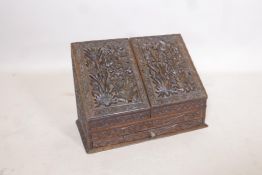 A C19th Anglo Indian wood stationery box with fall front and two doors over a single drawer, well