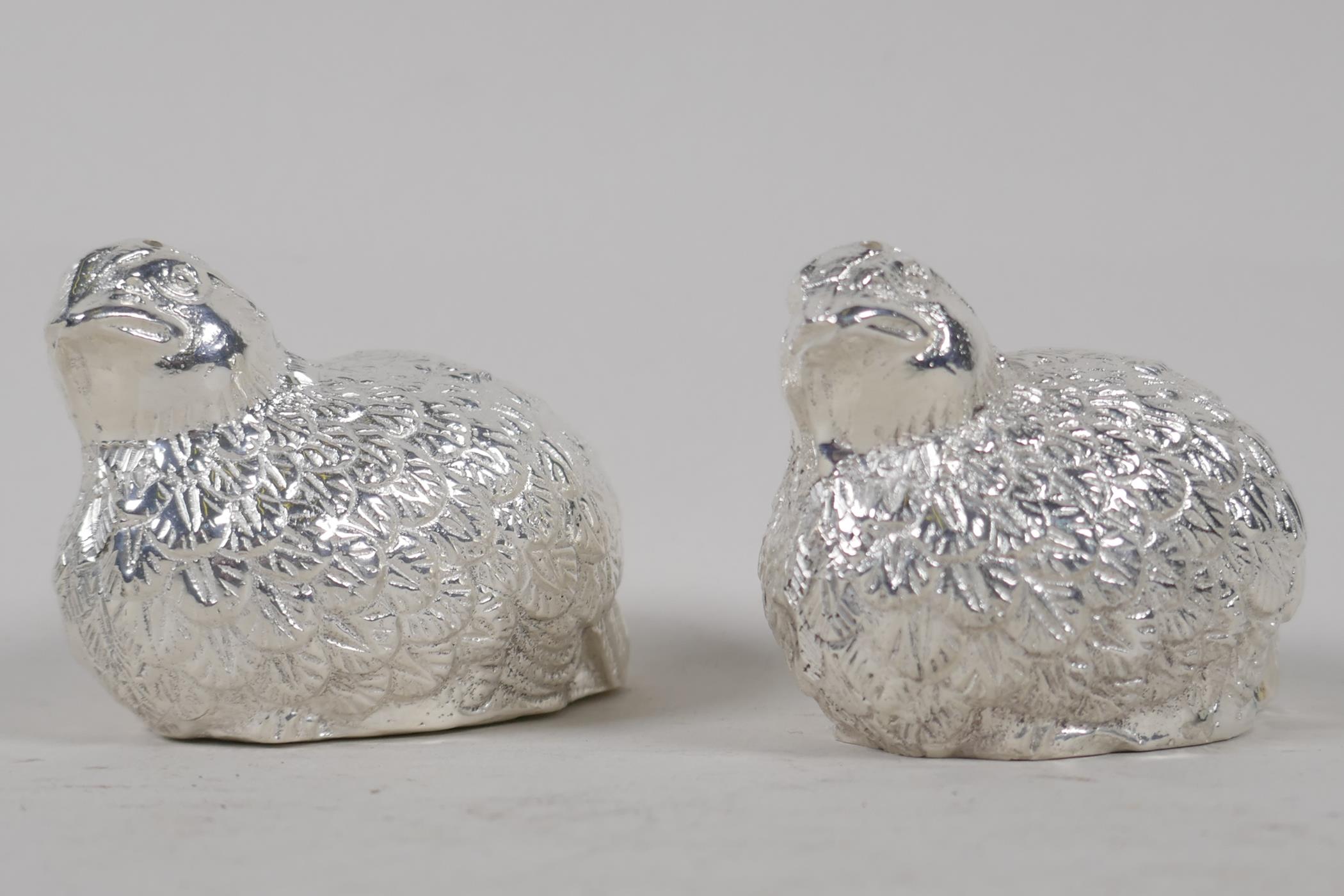 A silver plated salt & pepper cruet cast, in the form of a quail, 3" long