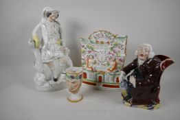 A 19th C Staffordshire flat back clock piece (11" high), together with a figurine of a Hunter and