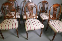 A set of six (four + two) Adam style dining chairs, with pierced splat backs, raised on fluted