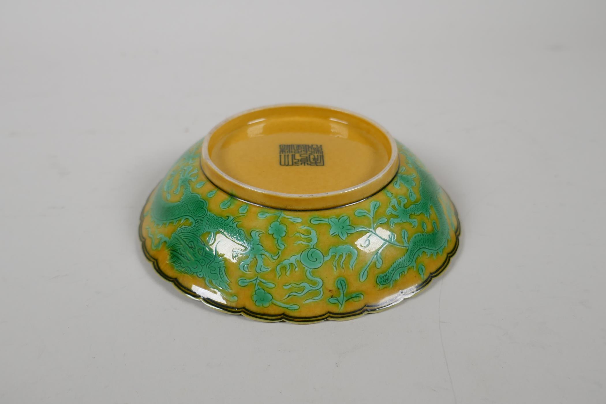 A yellow ground porcelain dish with frilled rim and incised green dragon decoration, Chinese - Image 4 of 5