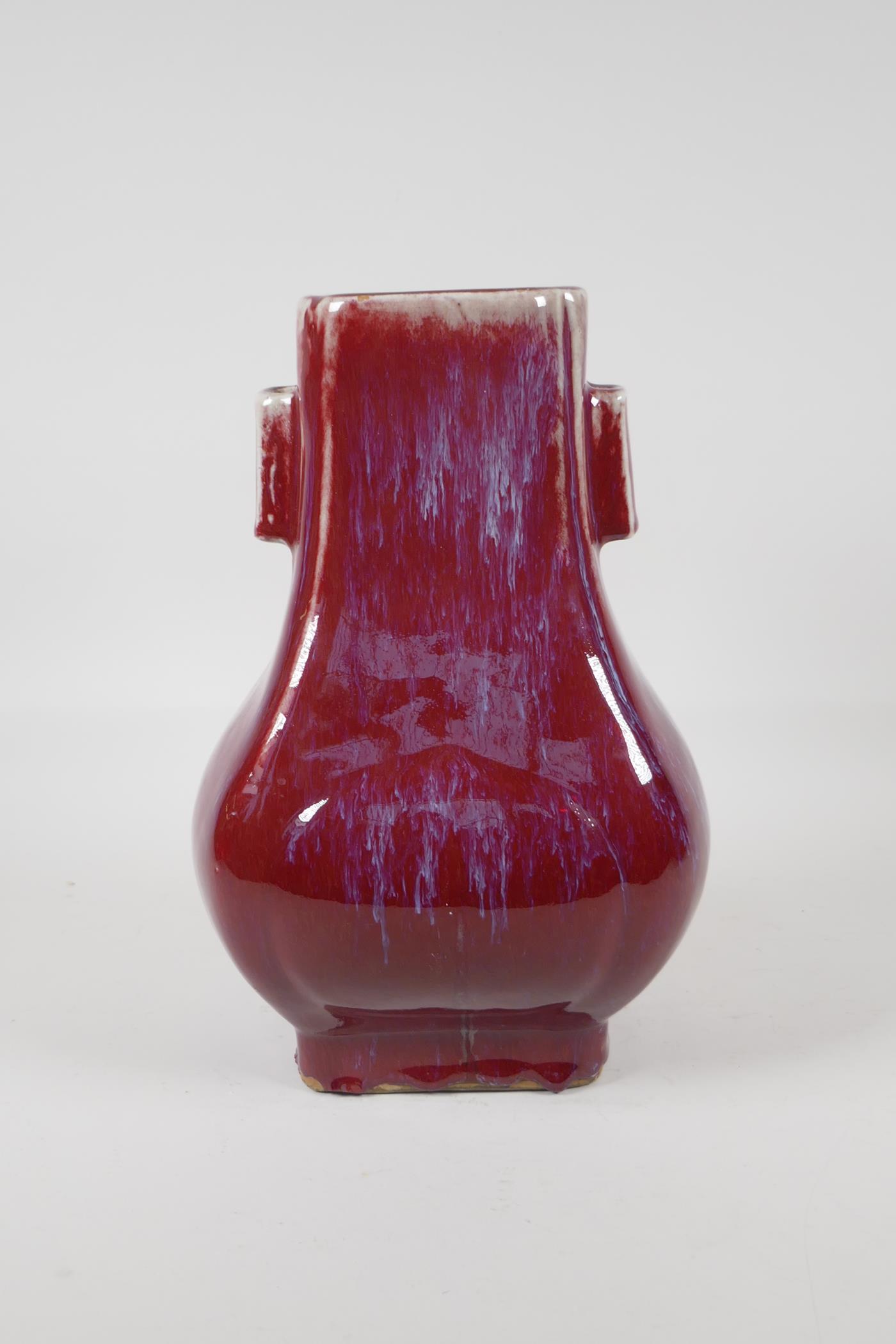 A Chinese flambe glazed porcelain vase with two lug handles, 11" high