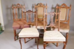 A pair of Edwardian walnut Grecian style chairs with carved and pierced backs, and three C19th