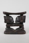 An African Luba carved hardwood figural headrest. 7½" wide x 7½" high