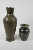 A mottled green soapstone jar, 6½" high and a painted/glazed metal vase, with the appearance of