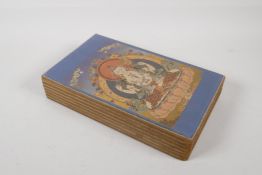 A Tibetan printed concertina book depicting various images of thangkas, 6" x 11"