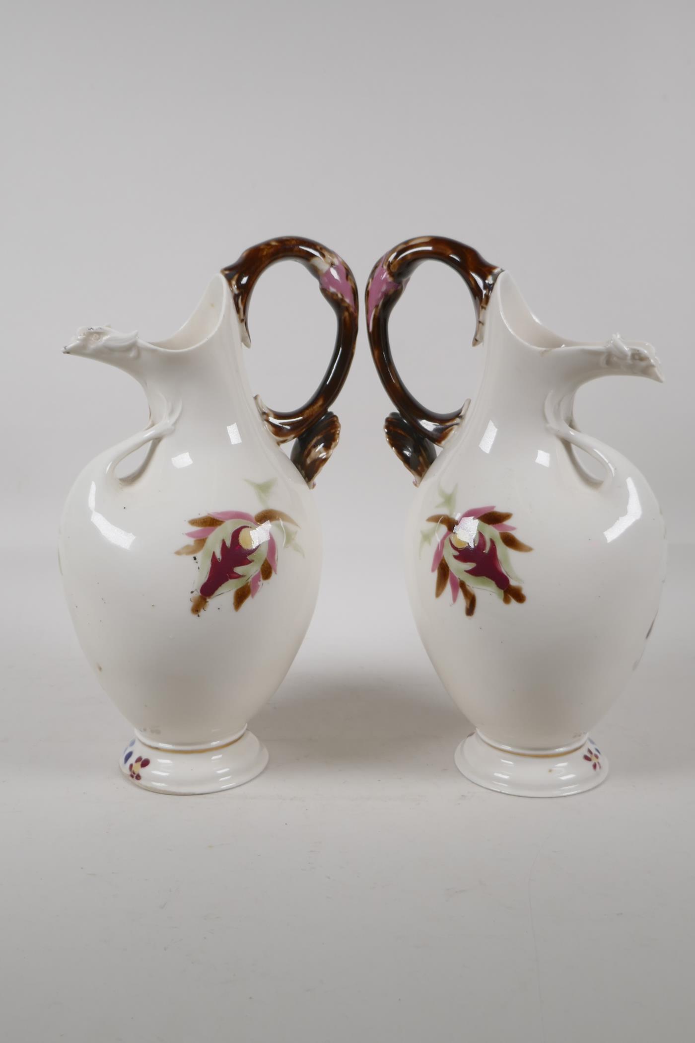 A pair of continental Zsolnay style ewers, decorated with an Iznik design. 11" high - Image 5 of 6