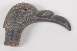 A C19th horn parasol handle, carved as as ducks head. 2" long