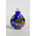 An enamelled blue Peking glass snuff bottle, decorated with waterfowl in a lotus pond, three