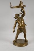 A cast brass centre-piece in the form of Bacchus with a serpent, 16" high