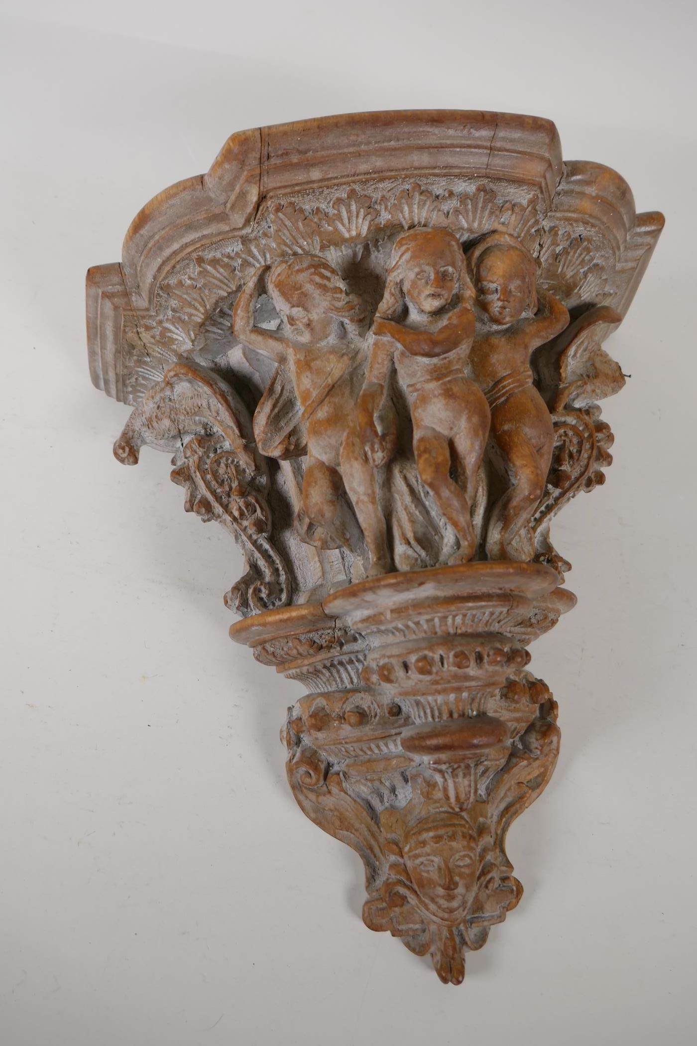 An ornately carved wood wall bracket. Carved in the form of a classical column capital. 13" long - Image 5 of 5