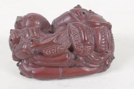 A Japanese wooden Netsuke, formed as a pile of insects, (signed), 2" long