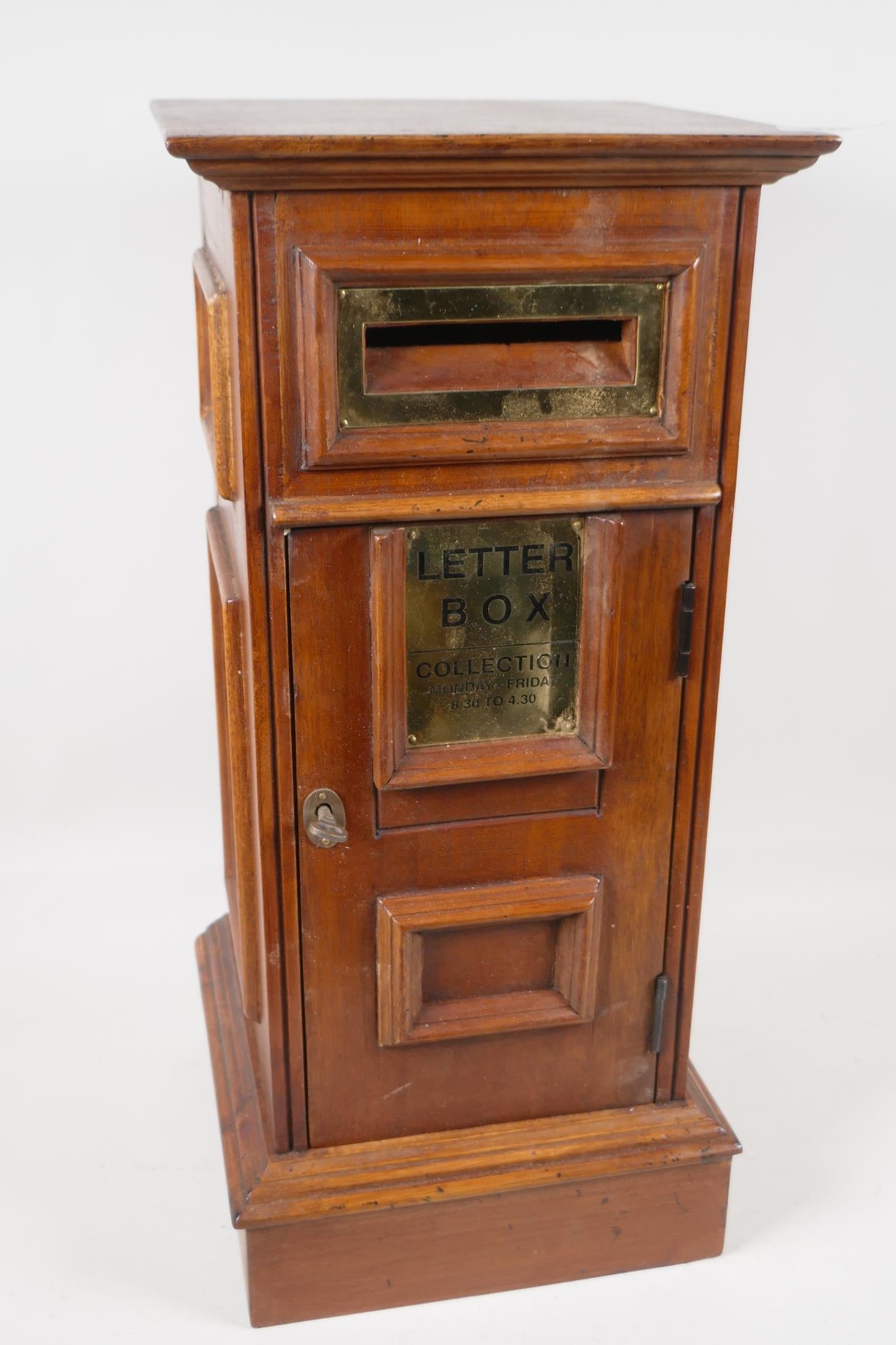 A wooden hall letter box, with brass detail panel. 20" high x 9" square