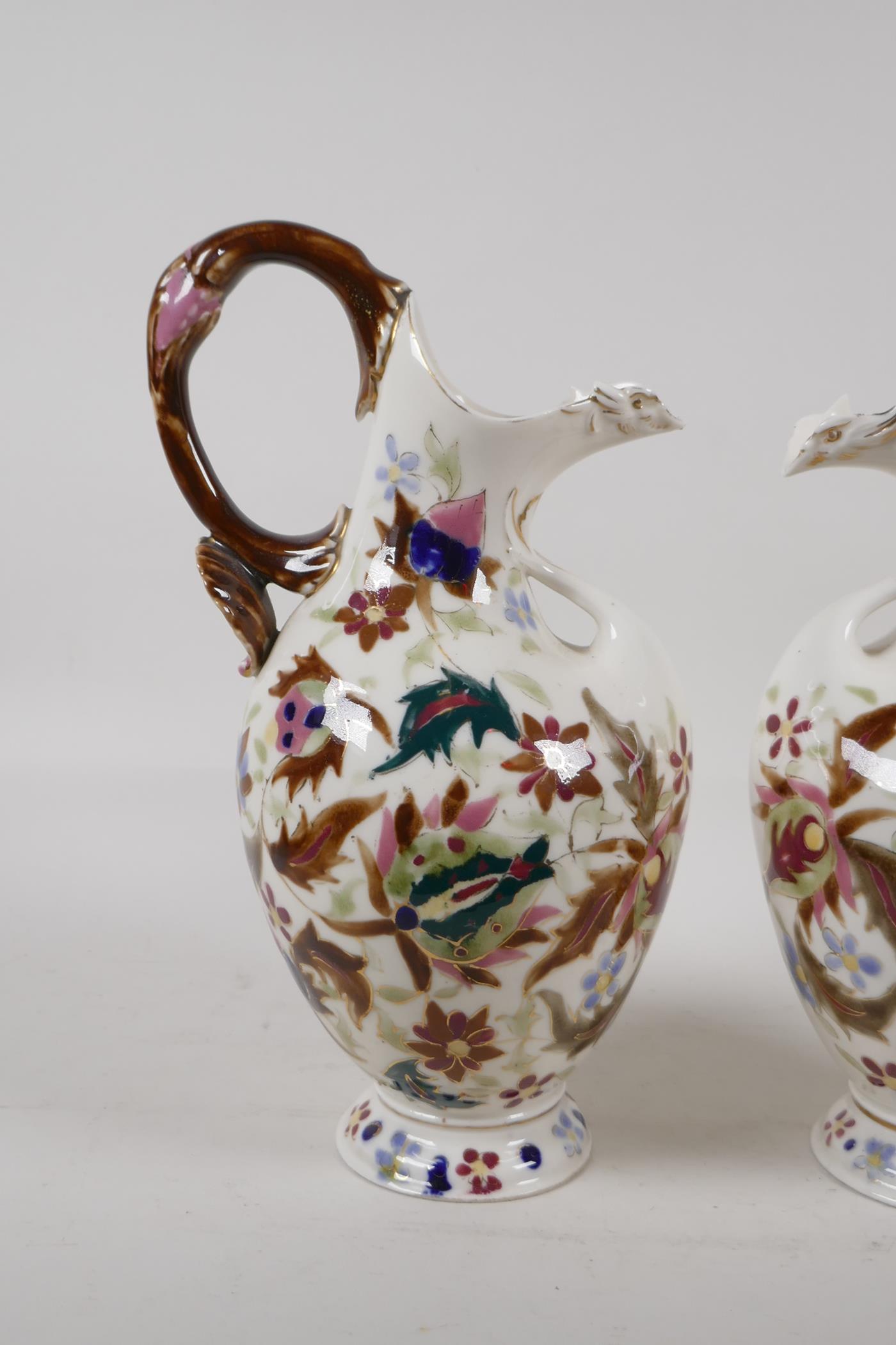 A pair of continental Zsolnay style ewers, decorated with an Iznik design. 11" high - Image 2 of 6