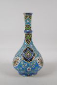 A continental pottery bottle vase, with enamelled Iznik style decoration. Impressed L.W to base. AF,