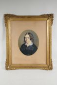 A Victorian overpainted portrait photo of a woman in mourning, in a good gilt frame, 14" x 18"