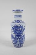 A blue and white porcelain rouleau vase decorated with waterfowl in a lotus pond, Chinese Kangxi
