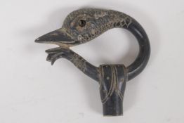 A C19th horn parasol handle, carved as a birds head. 2½" diameter
