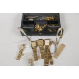 A leather jewellery box containing a lady's rolled gold bracelet watch. Various ladies' and