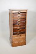 A tambour front oak filling cabinet, AF, lacks key & bottom drawer. 19" x 17½" x 45" high