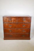 C19th teak campaign chest in two sections, with brass mounts and military style recessed handles,