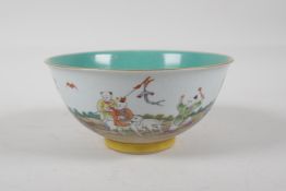 A Chinese polychrome porcelain rice bowl decorated with children playing in a garden, with a