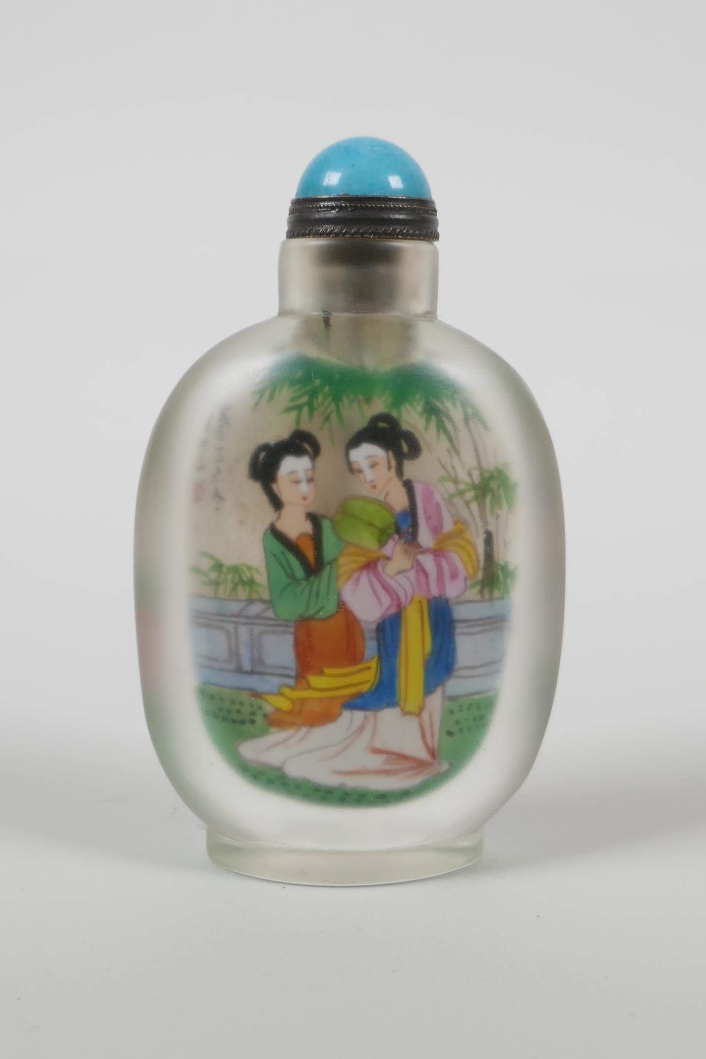 A Chinese reverse decorated glass snuff bottle depicting two women in a garden to each side, 3½" - Image 2 of 2