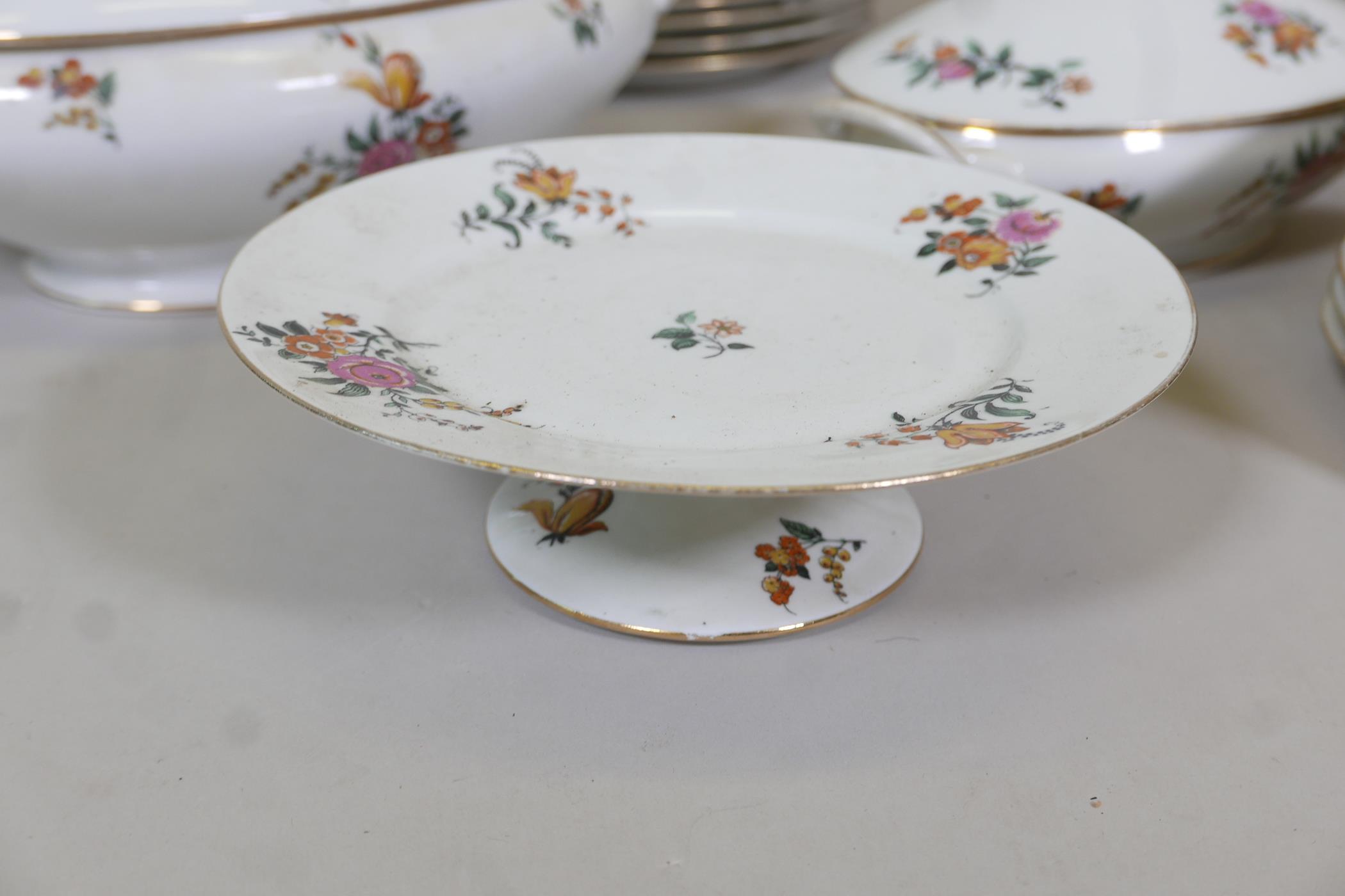 A Limoges floral decorated part dinner service comprising 10" and 12" oval tureens and covers, two - Image 3 of 6