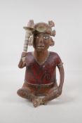 An antique south American Nayarit tribal terracotta seated figure, carrying a sceptre/club. With