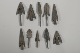 Ten Archaic style bronze arrowheads, largest 3"