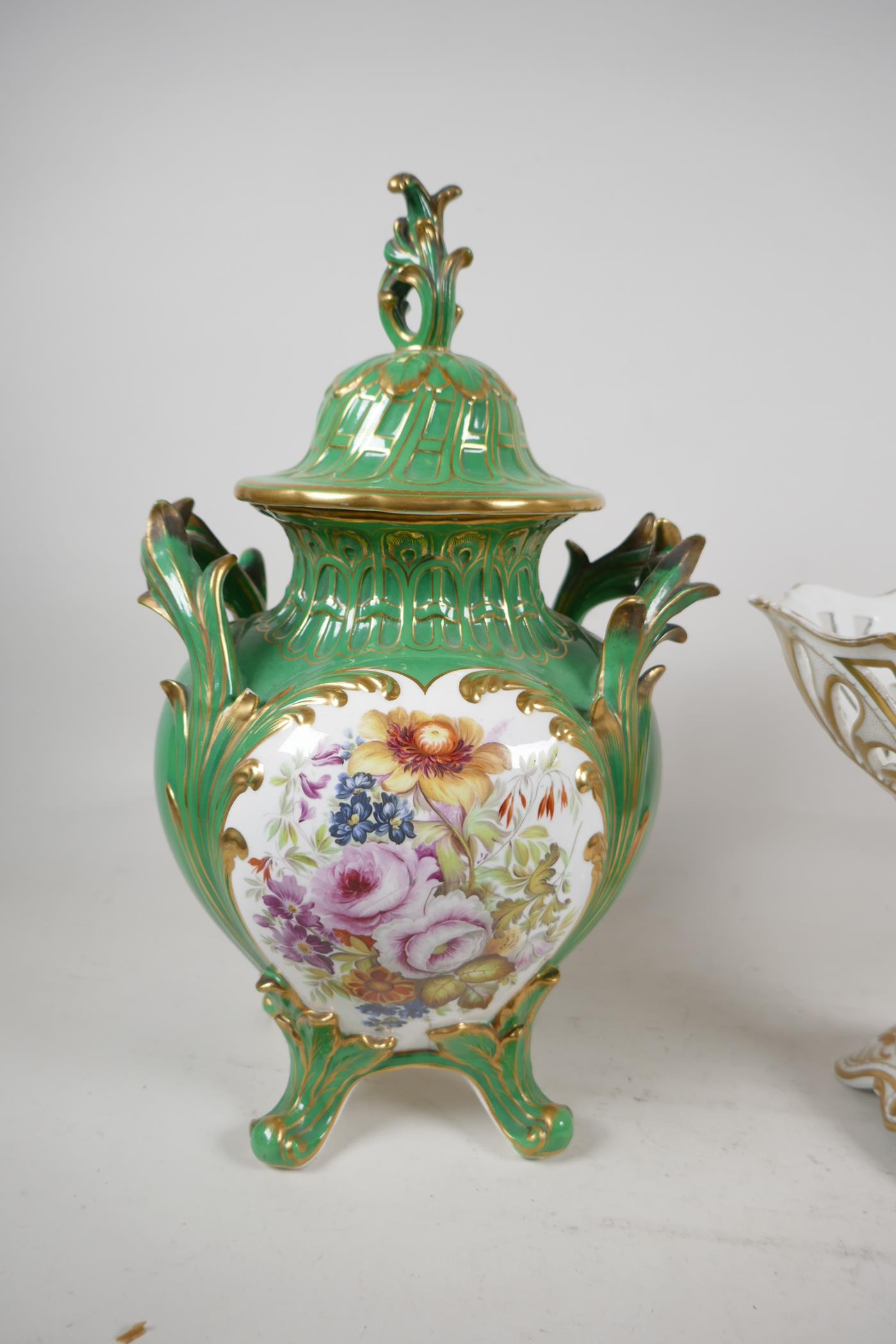 A C19th European porcelain lidded two handled jar and cover, Painted with flowers raised on four - Image 3 of 4