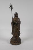 A Chinese bronze figure of Buddha on a lotus with gilt patina, 7 character mark to base, 9½" high